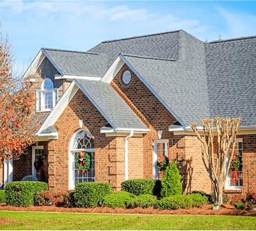 house with windows and gutters, roofing winston salem, roof repair greensboro, roofing company high point, roof repair mount airy