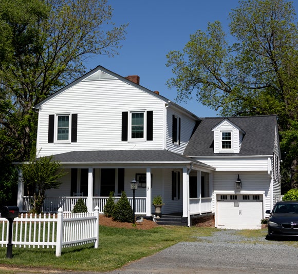 two story residential house showcasing roof installation from a Winston Salem NC roofing company